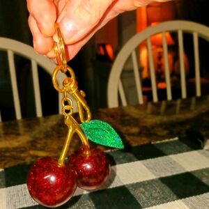 Sparkling Cherry Keychain with Gold and Green Accents